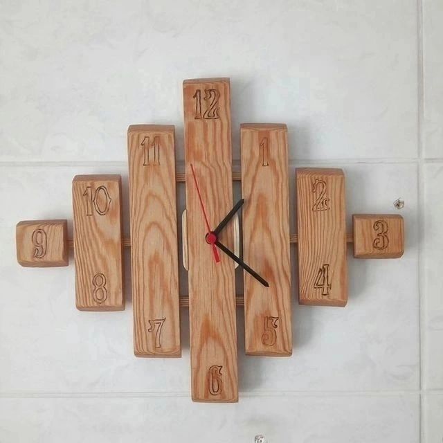 A uniquely designed wall clock composed of wooden blocks representing each hour