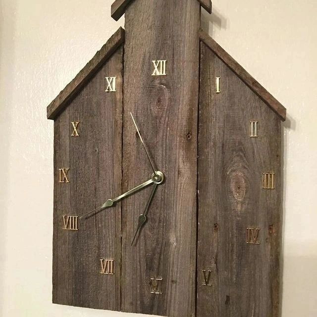 Unique wooden clock shaped like a house with Roman numerals