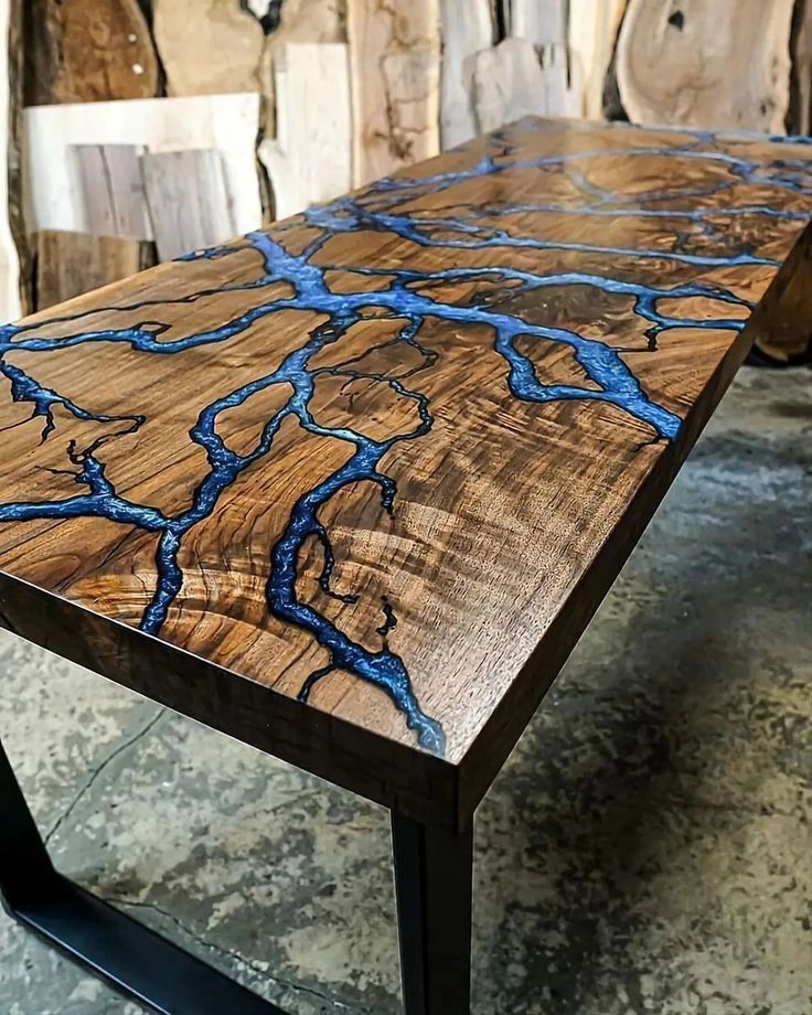 A unique wooden table with blue resin inlays