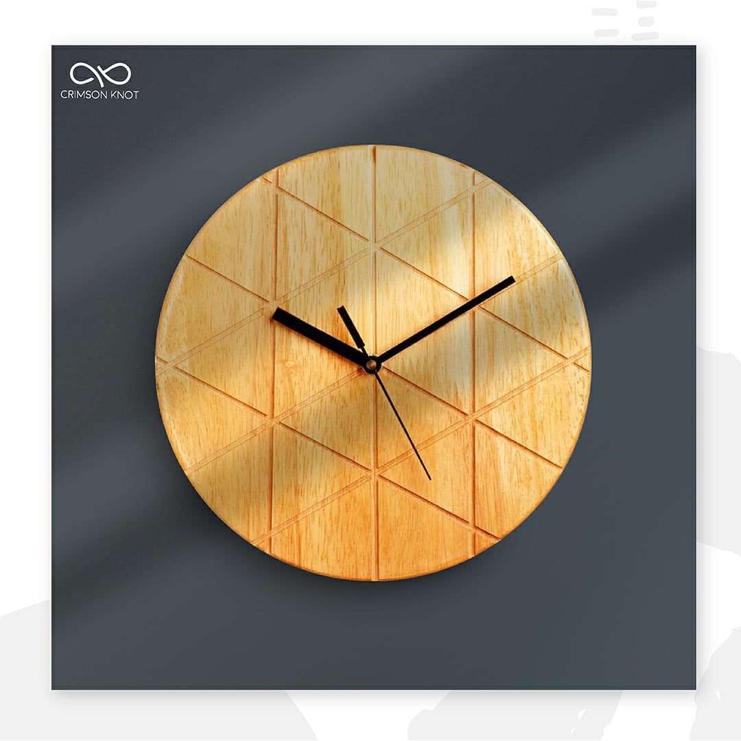 A wooden wall clock with a minimalist geometric pattern on the grain