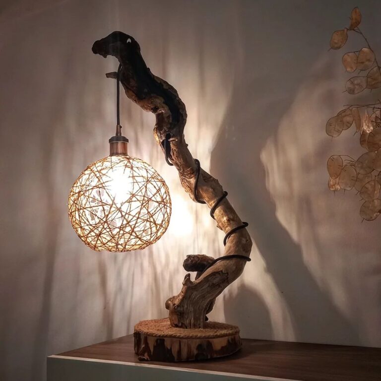 A unique lamp with a spherical geometric shade hanging from a curvaceous wooden stand