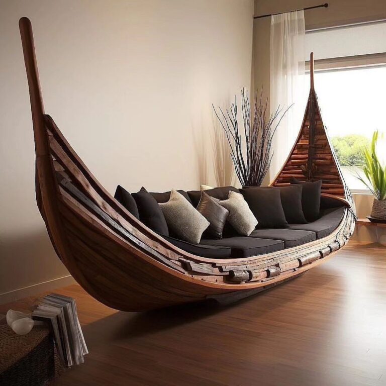 A unique boat-inspired indoor swing sofa with cushions