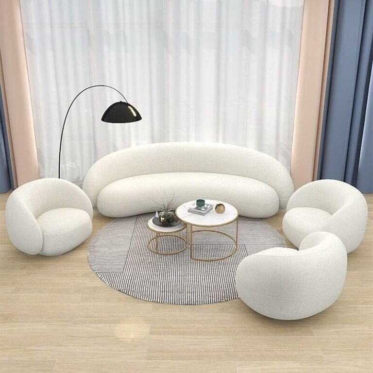 A modern living room with curved furniture